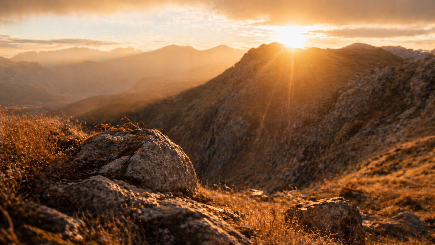 Early morning light breaking over mountains, strong and steady